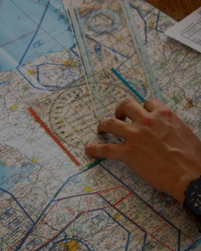Travel planning with a map and packed bags